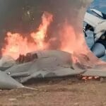 The aircraft was engulfed in flames, blazing intensely in an open field near Agra, sending thick smoke into the sky.